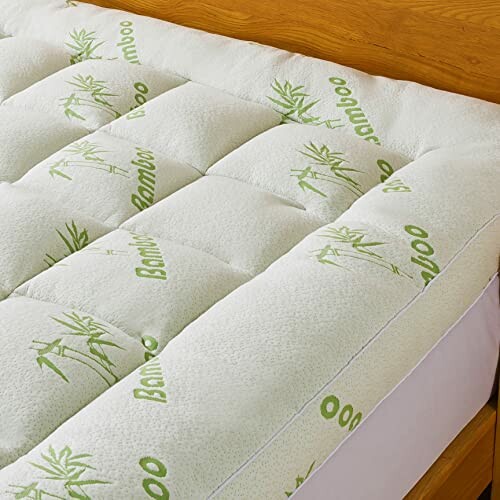 Bamboo mattress topper on a bed.