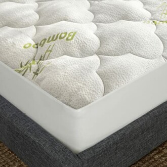Close-up of a bamboo mattress topper on a bed.