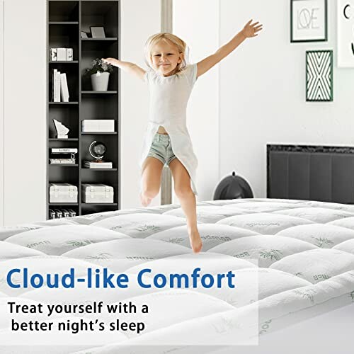 Child joyfully jumping on a comfortable mattress in a bedroom.