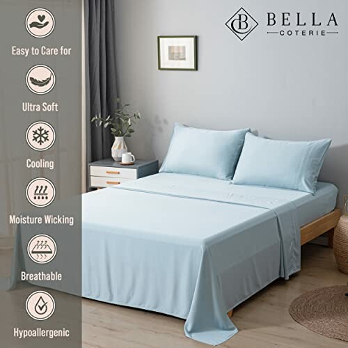 Light blue bed with sheets and pillows, featuring cooling and hypoallergenic properties.