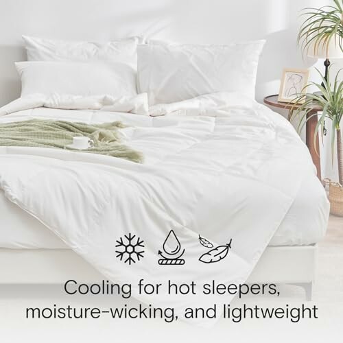 White bed with cooling comforter, pillows, and icons indicating cooling, moisture-wicking, lightweight features.