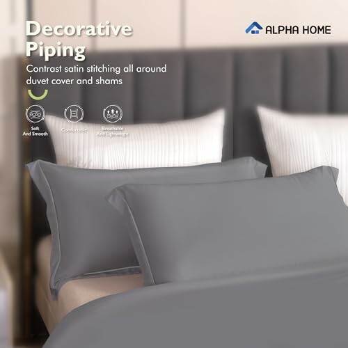 Decorative piping on gray duvet cover and shams by Alpha Home.