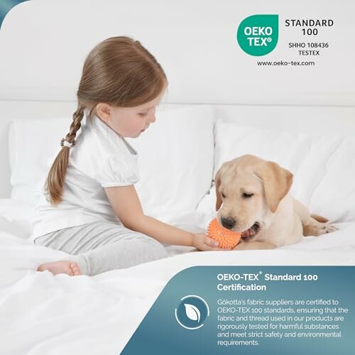 Girl on bed playing with a puppy holding a toy, OEKO-TEX certification badge.