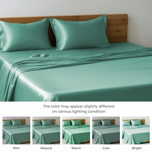 Green satin bed sheets with lighting variations.