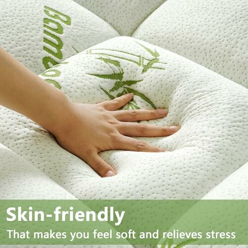 Hand pressing soft bamboo mattress with text about skin-friendly features.