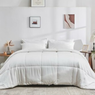 Minimalist bedroom with white bedding and wall art