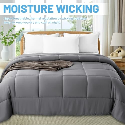 Gray moisture-wicking comforter on a bed with white pillows.