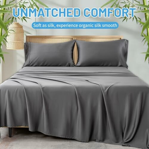 Luxurious gray silk bed sheet set on a bed with bamboo decorations.