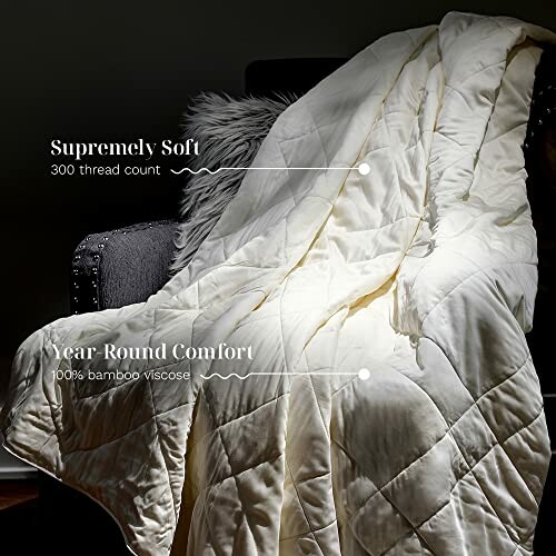 Close-up of a white bamboo viscose comforter with text highlighting its silky sateen weave and machine washability.