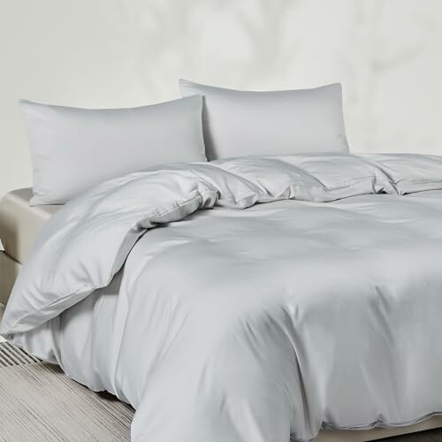 White bedding set with pillows and comforter.