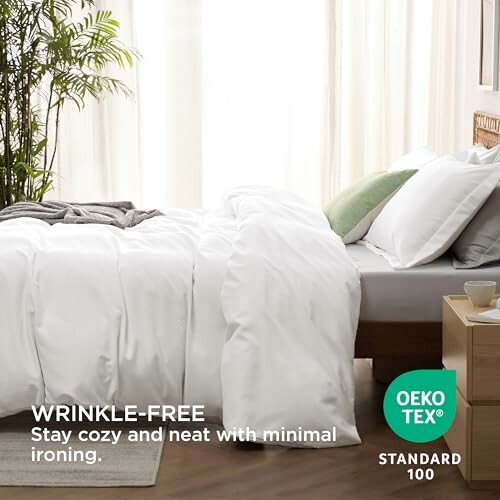 White wrinkle-free bedding on a neatly made bed with Oeko-Tex Standard 100 certification.